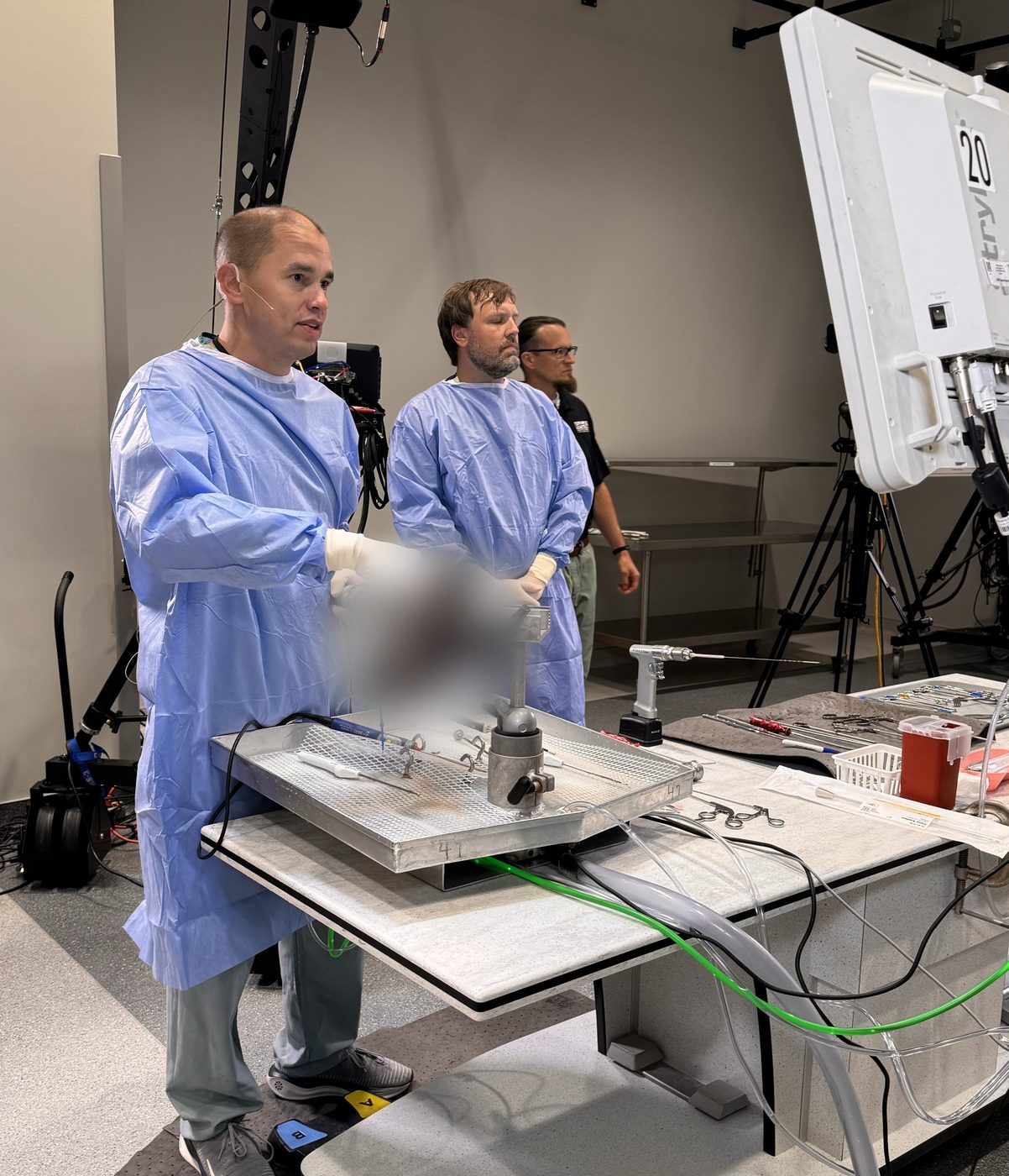 Dr. Gwathmey performing a live surgical demonstration for other surgeons